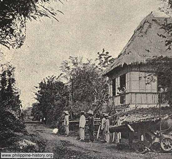 Photo of Filipino soldiers with a Spanish canon at Fort Malate, Manila circa 1889 