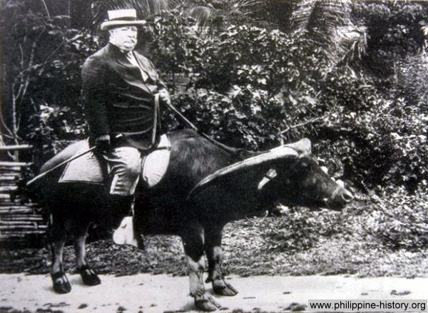 Picture of General William Howard Taft riding a water buffalo in the Philippines